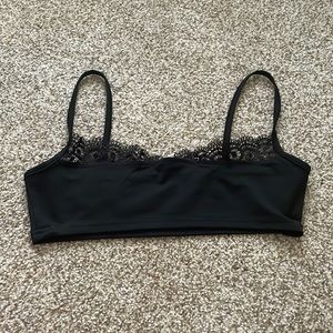 a black cropped tank top with lace on top